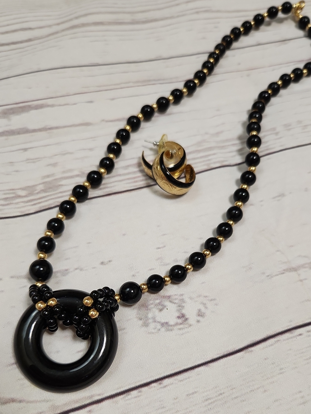 Elegant Black and Gold Beaded Necklace with Circular Pendant